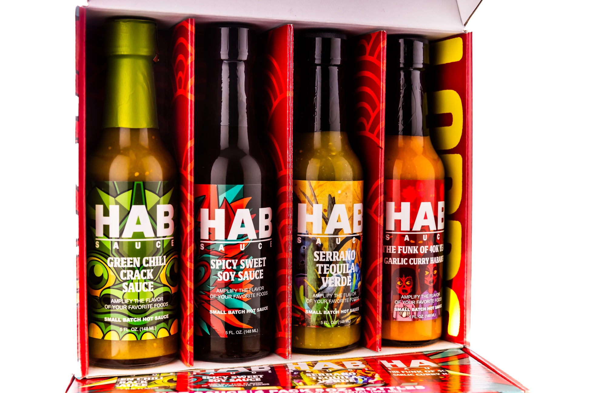 Four bottles of Hab Sauce in a box with colorful labels on a white background